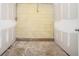 Unfinished basement with damaged walls and floor at 2875 Monterey Dr, Decatur, GA 30032