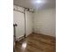Basement with white-painted cinderblock walls and laminate flooring at 2875 Monterey Dr, Decatur, GA 30032