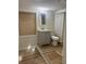 Bathroom featuring grey vanity, white toilet, and tiled floors at 2875 Monterey Dr, Decatur, GA 30032