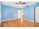 Bedroom featuring hardwood floors, light blue walls and ceiling fan at 2875 Monterey Dr, Decatur, GA 30032