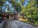 Charming brick ranch-style home with mature trees and a convenient carport at 2875 Monterey Dr, Decatur, GA 30032