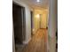 Hallway with vinyl flooring, and white doors and trim at 2875 Monterey Dr, Decatur, GA 30032