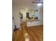 View of living room and kitchen with hardwood floors and white walls at 2875 Monterey Dr, Decatur, GA 30032