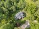 Aerial view of a home surrounded by mature trees, showcasing its privacy and wooded lot at 2958 Paul Harris Rd, Dallas, GA 30157