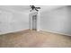 A light-filled, carpeted bedroom featuring a ceiling fan and a closet at 2958 Paul Harris Rd, Dallas, GA 30157