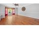 Open dining room featuring hardwood floors, wainscoting, large window, and stylish decor at 2958 Paul Harris Rd, Dallas, GA 30157