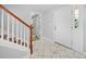 Inviting entryway with decorative tile flooring and staircase, providing a warm welcome at 2958 Paul Harris Rd, Dallas, GA 30157