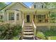 Charming home featuring a covered porch with wooden steps and decorative lion statues at 2958 Paul Harris Rd, Dallas, GA 30157