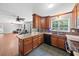 Open kitchen with granite countertops, dark wood cabinets, stainless appliances, and a view of the living area at 2958 Paul Harris Rd, Dallas, GA 30157