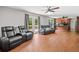 Living room featuring hardwood floors, access to the outdoor deck, and a view into the kitchen at 2958 Paul Harris Rd, Dallas, GA 30157