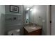 Cozy bathroom features granite counters, floating glass shelves, and updated fixtures at 3338 Peachtree Ne Rd # 1506, Atlanta, GA 30326