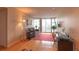 Bright living room with hard wood floors, a desk, and access to a city-view balcony at 3338 Peachtree Ne Rd # 1506, Atlanta, GA 30326