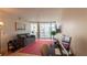Cozy living room with a sofa, hardwood floors, and city view balcony at 3338 Peachtree Ne Rd # 1506, Atlanta, GA 30326