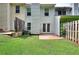 Backyard featuring a grassy lawn and a small patio, enclosed by a fence at 6344 Wellington Walk Way, Lithonia, GA 30058