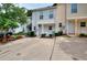 Inviting townhouse features a quaint front porch and well-maintained landscaping at 6344 Wellington Walk Way, Lithonia, GA 30058