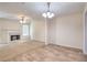 Inviting living room with a fireplace, a ceiling fan, and stylish laminate flooring at 6344 Wellington Walk Way, Lithonia, GA 30058