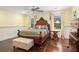 Cozy bedroom with hardwood floors, a ceiling fan, and bright, cheery decor at 7660 Treeridge Ct, Atlanta, GA 30350