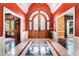 Elegant foyer with a decorative tile floor, arched doorways, and a stunning glass-paned front door at 7660 Treeridge Ct, Atlanta, GA 30350