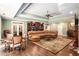 Spacious living room featuring hardwood floors, coffered ceilings, custom bookshelves and fireplace at 7660 Treeridge Ct, Atlanta, GA 30350