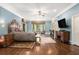 Spacious primary bedroom with hardwood floors, a sitting area, and an abundance of natural light at 7660 Treeridge Ct, Atlanta, GA 30350