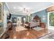 Spacious primary bedroom with hardwood floors, ceiling fan, and large windows offering ample natural light at 7660 Treeridge Ct, Atlanta, GA 30350