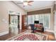 Bright office space with hardwood floors, large windows, and a functional desk area at 7660 Treeridge Ct, Atlanta, GA 30350