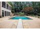 A large, inviting inground pool with a diving board and ample lounge space at 7660 Treeridge Ct, Atlanta, GA 30350