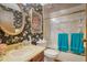 Cozy bathroom highlighted by floral wallpaper, framed print, and tiled shower at 1377 Tucker Woods Dr, Norcross, GA 30093