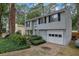 Charming home featuring a well-kept lawn, classic siding, and an attached garage, perfect for suburban living at 1377 Tucker Woods Dr, Norcross, GA 30093