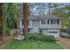 Charming home featuring a well-kept lawn, classic siding, and an attached garage, perfect for suburban living at 1377 Tucker Woods Dr, Norcross, GA 30093