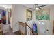 Bright hallway featuring a staircase, neutral walls, and access to multiple rooms, creating a welcoming transition space at 1377 Tucker Woods Dr, Norcross, GA 30093