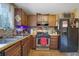 Functional kitchen featuring ample cabinet space, essential appliances, and a practical layout for everyday cooking at 1377 Tucker Woods Dr, Norcross, GA 30093