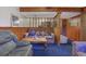 Relaxing living room showcasing wood paneling, plush seating, and cozy ambiance at 1377 Tucker Woods Dr, Norcross, GA 30093
