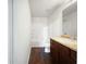 Well-lit bathroom with a shower-tub combination and dark wood-grain vanity at 2138 Chadwick Sw Rd, Atlanta, GA 30331
