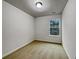 This is a simple bedroom with neutral carpet, light walls, and a bright window at 2138 Chadwick Sw Rd, Atlanta, GA 30331