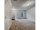 Bright, open living room with neutral carpet and plenty of natural light at 2138 Chadwick Sw Rd, Atlanta, GA 30331