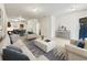 Bright, staged living room with plush furniture and an open floor plan at 2138 Chadwick Sw Rd, Atlanta, GA 30331