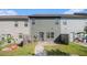 Backyard view featuring a small patio and grassy area, partially fenced at 255 Orchard Dr, Covington, GA 30014