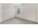 Bright bedroom features neutral walls, carpet, and window offering ample natural light at 255 Orchard Dr, Covington, GA 30014