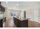 Modern kitchen with a spacious island, stainless steel appliances, and hardwood floors at 255 Orchard Dr, Covington, GA 30014