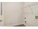 Functional laundry room with wire shelving and hookups for a washer and dryer at 255 Orchard Dr, Covington, GA 30014