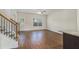Cozy living room with hardwood floors, staircase and plenty of natural light at 255 Orchard Dr, Covington, GA 30014