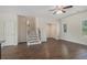 Spacious living room featuring hardwood floors, stairs, and natural lighting at 255 Orchard Dr, Covington, GA 30014