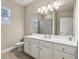 Clean bathroom with a vanity, a large mirror, and a shower-tub combination at 2721 Grapevine Cir # 1701, Cumming, GA 30041