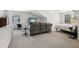 Spacious bedroom featuring sitting area and television at 2721 Grapevine Cir # 1701, Cumming, GA 30041