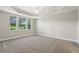 Spacious bedroom with three windows, neutral paint, and ceiling fan at 2721 Grapevine Cir # 1701, Cumming, GA 30041