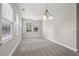Bright dining area with large windows and a modern chandelier at 2721 Grapevine Cir # 1701, Cumming, GA 30041