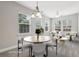 Bright dining room with natural light and stylish furniture at 2721 Grapevine Cir # 1701, Cumming, GA 30041