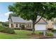 Charming two-story home with attached garage, well-maintained landscaping, and mature trees at 2721 Grapevine Cir # 1701, Cumming, GA 30041