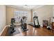 Community gym equipped with modern exercise machines and hardwood floors for a complete workout at 2721 Grapevine Cir # 1701, Cumming, GA 30041